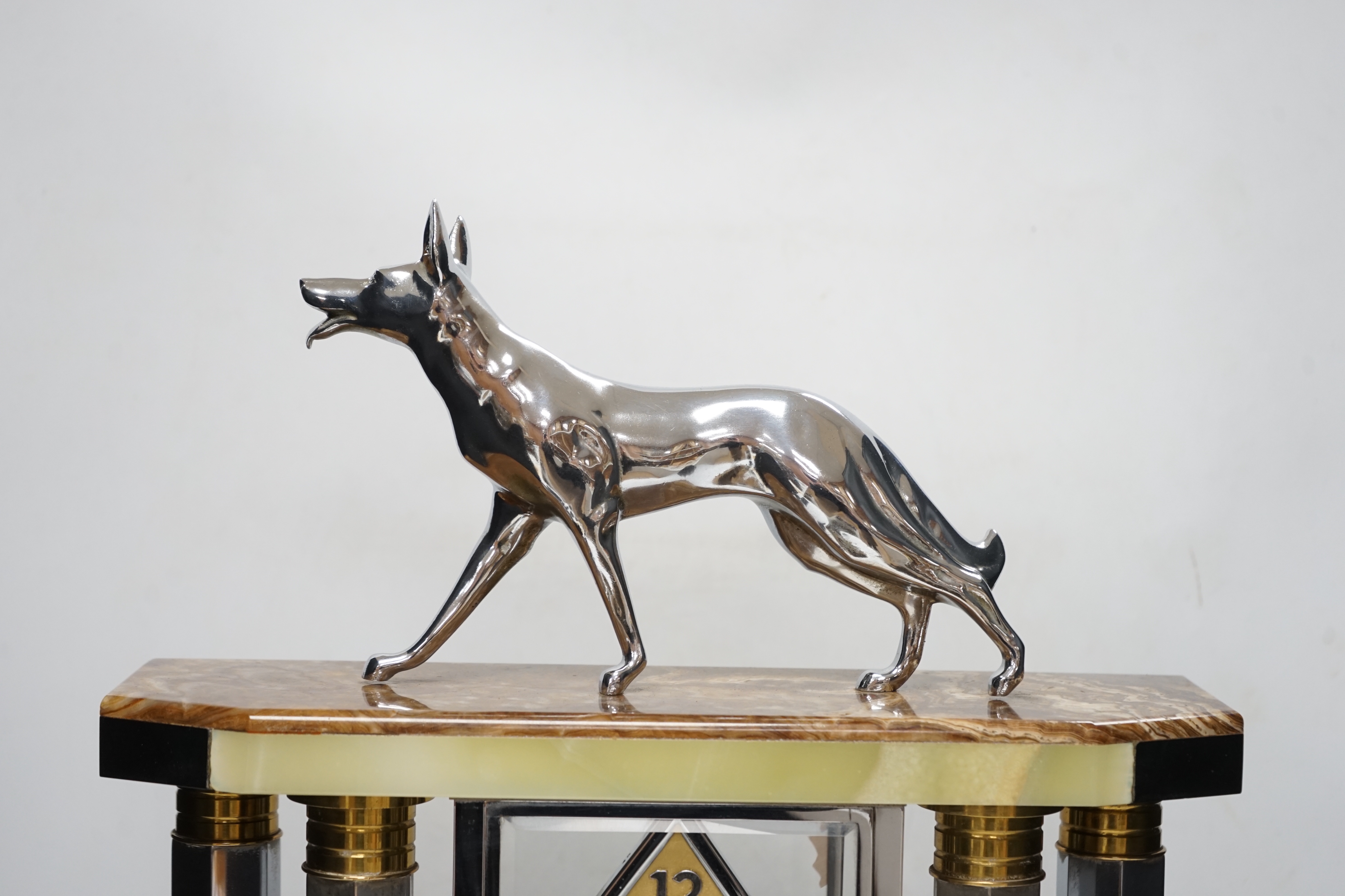 A French chrome, bronze and marble Art Deco 4 glass clock with two pedestal vase garnitures and a Wolf mount, attributed to Michel Decoux